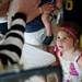 Royal Oak resident Elizabeth Turton, 4, watches as a balloon hat is made at Top of the Park on Friday, June 21. Daniel Brenner I AnnArbor.com